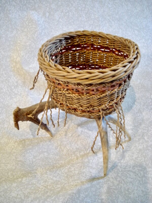 Whitetail deer antler sculpture, Tines Sitting Pretty, woven by Cathryn Peters, with smoked rattan reed, seagrass and copper weavers.