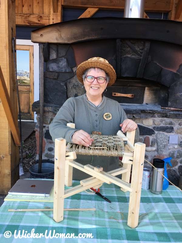 Cathryn Peters demonstrating how to weave a checkerboard seagrass stool as part of her Artist in Residence at North House Folk School in Grand Marais, MN.