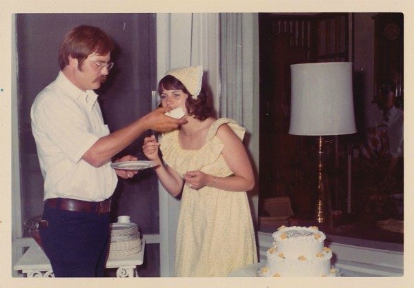 John and Cathryn Peters wedding day, cutting the cake