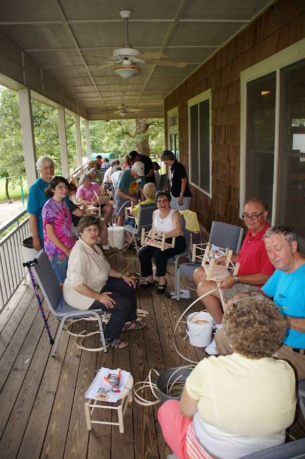 Members of The SeatWeavers' Guild demonstrating chair caning for the public 2013