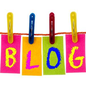 The word BLOG individually spelled out by letter, on a clothesline, held up with clothes pins. Weavin' Wicker Woman Blog.