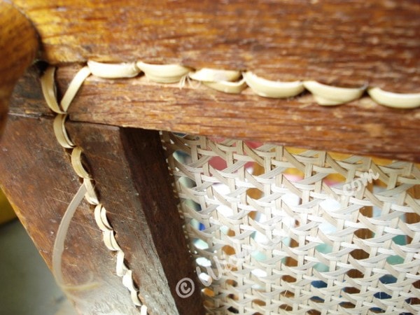 Bottom of square hole-to-hole cane chair showing corner detail of my "No-knot system". 