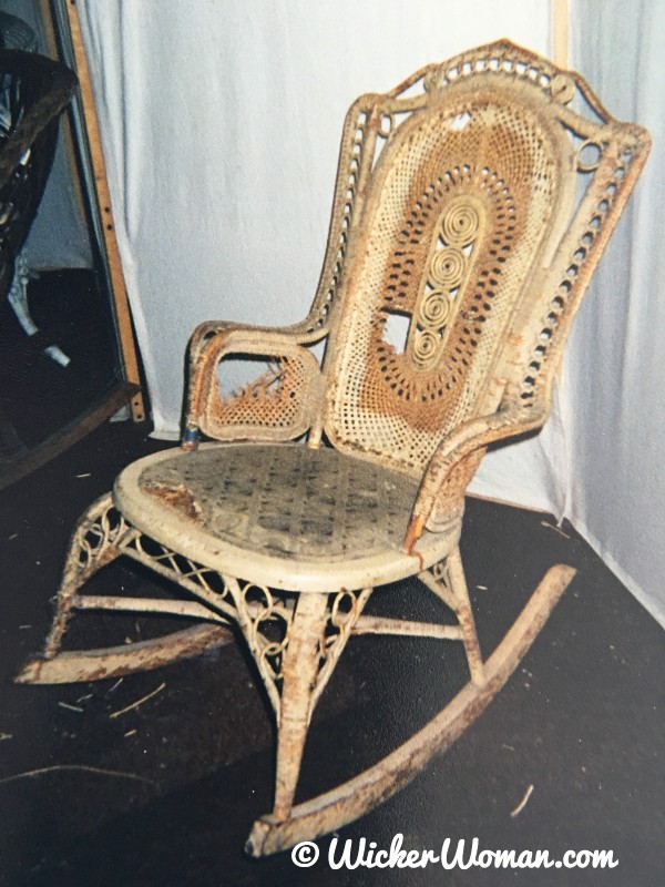 Victorian wicker rocker with detailed esparto grass design on back and under arms.