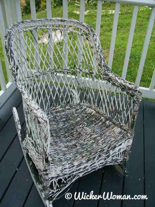 wicker reed rocker with flaking paint