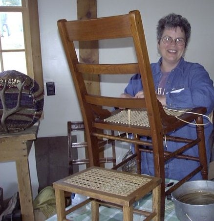 Cathryn Peters demonstrating hole-to-hole chair caning