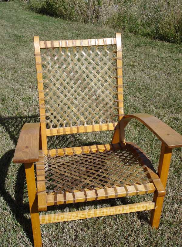 Rawhide woven on seat and back of Adirondack-style armchair.