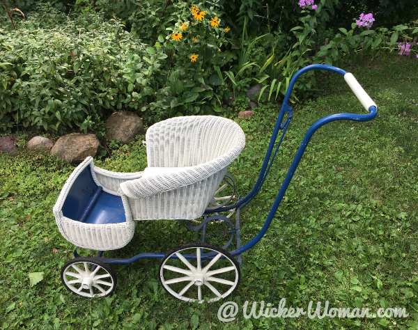 1920s white painted Lloyd Loom Baby Go-Cart with wooden wheels.