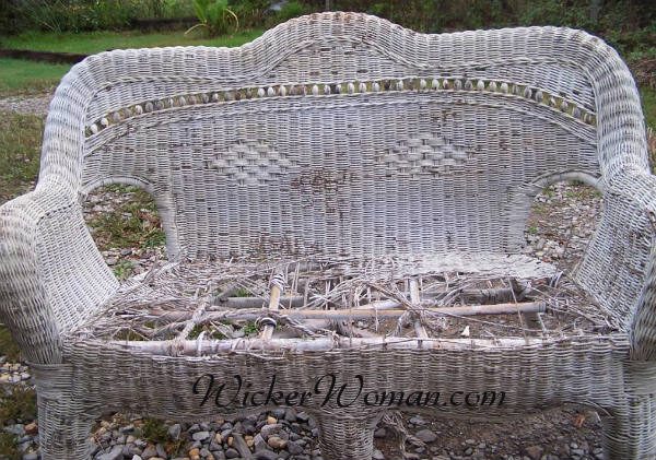 Modern wicker couch ruined by leaving outdoors unprotected. 